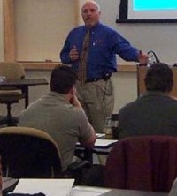 Photo of Pat Everly presenting to class